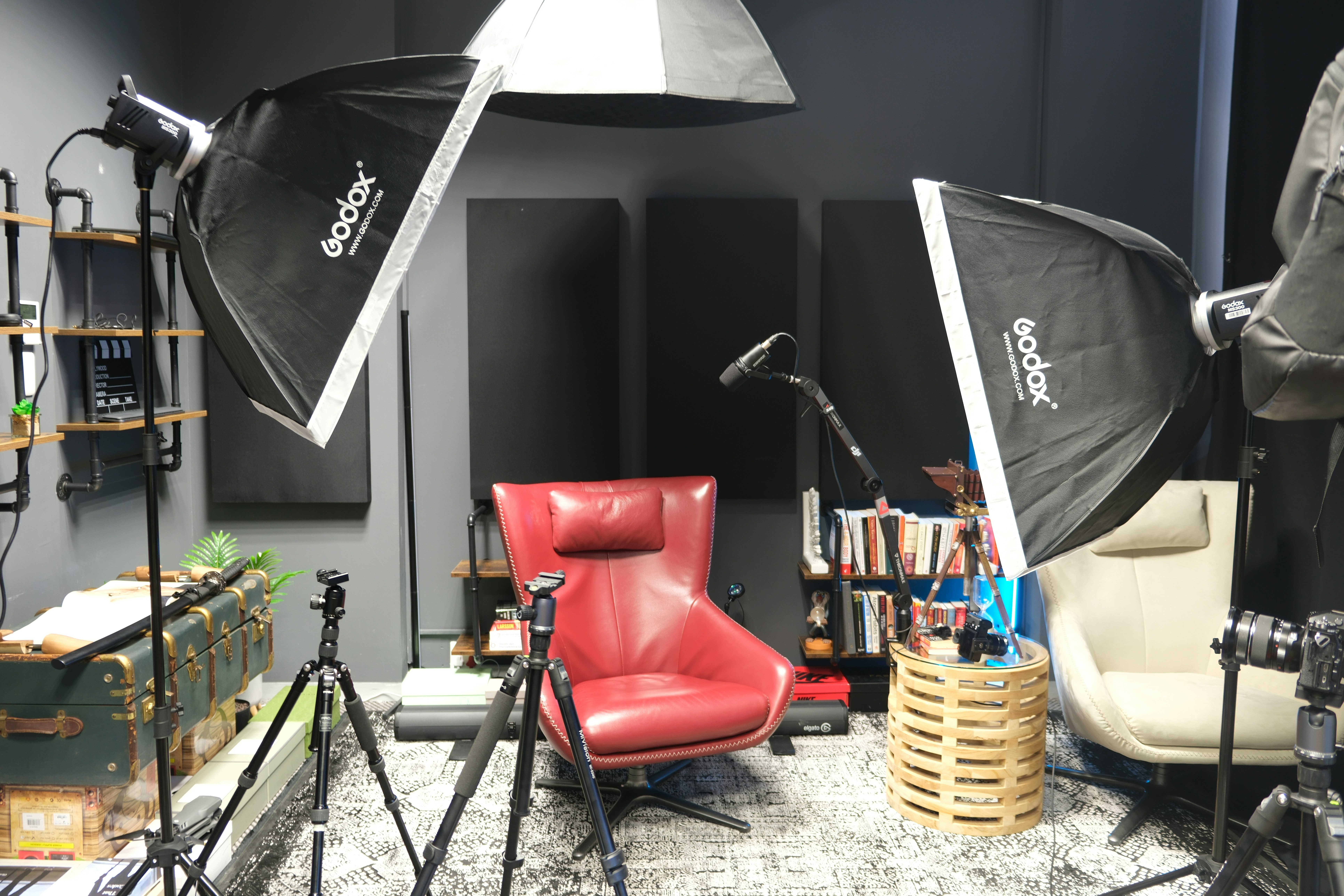 Behind the scenes look at a professional camera setup with lights in a studio focusing on a model