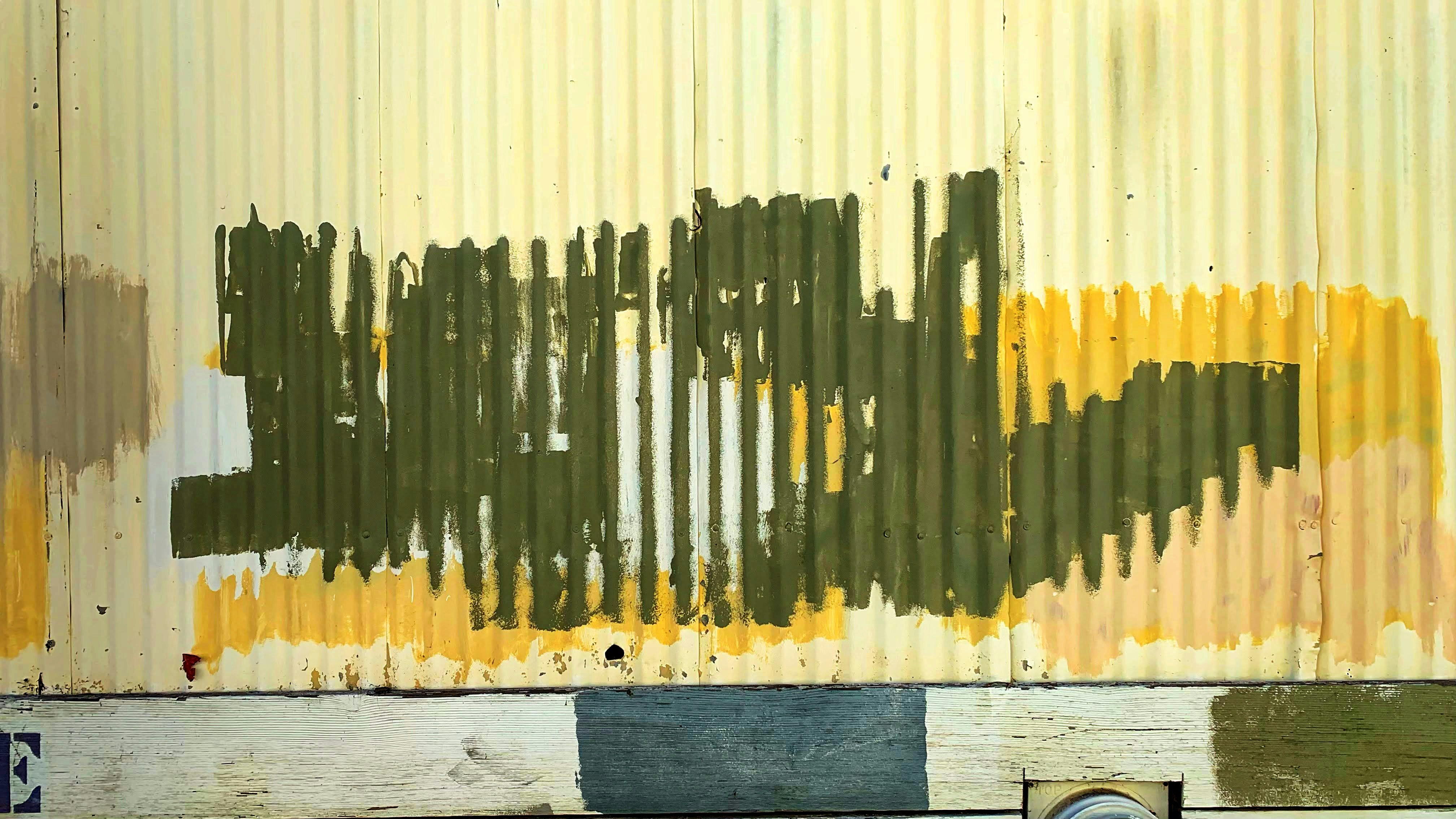 wooden painter tools brushes and color palette on a wooden table