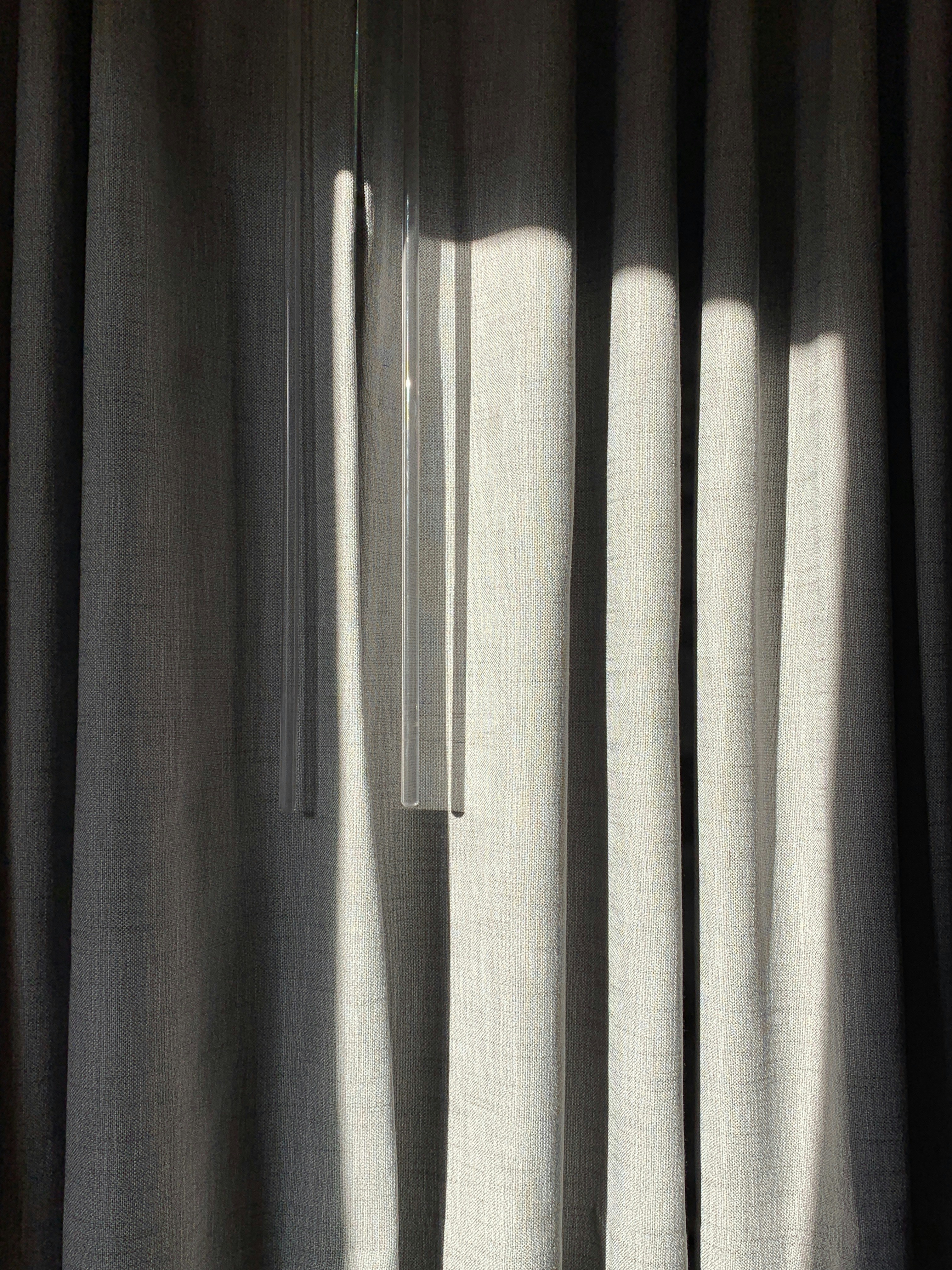 Close up texture of elegant vertical blind fabric in a neutral tone