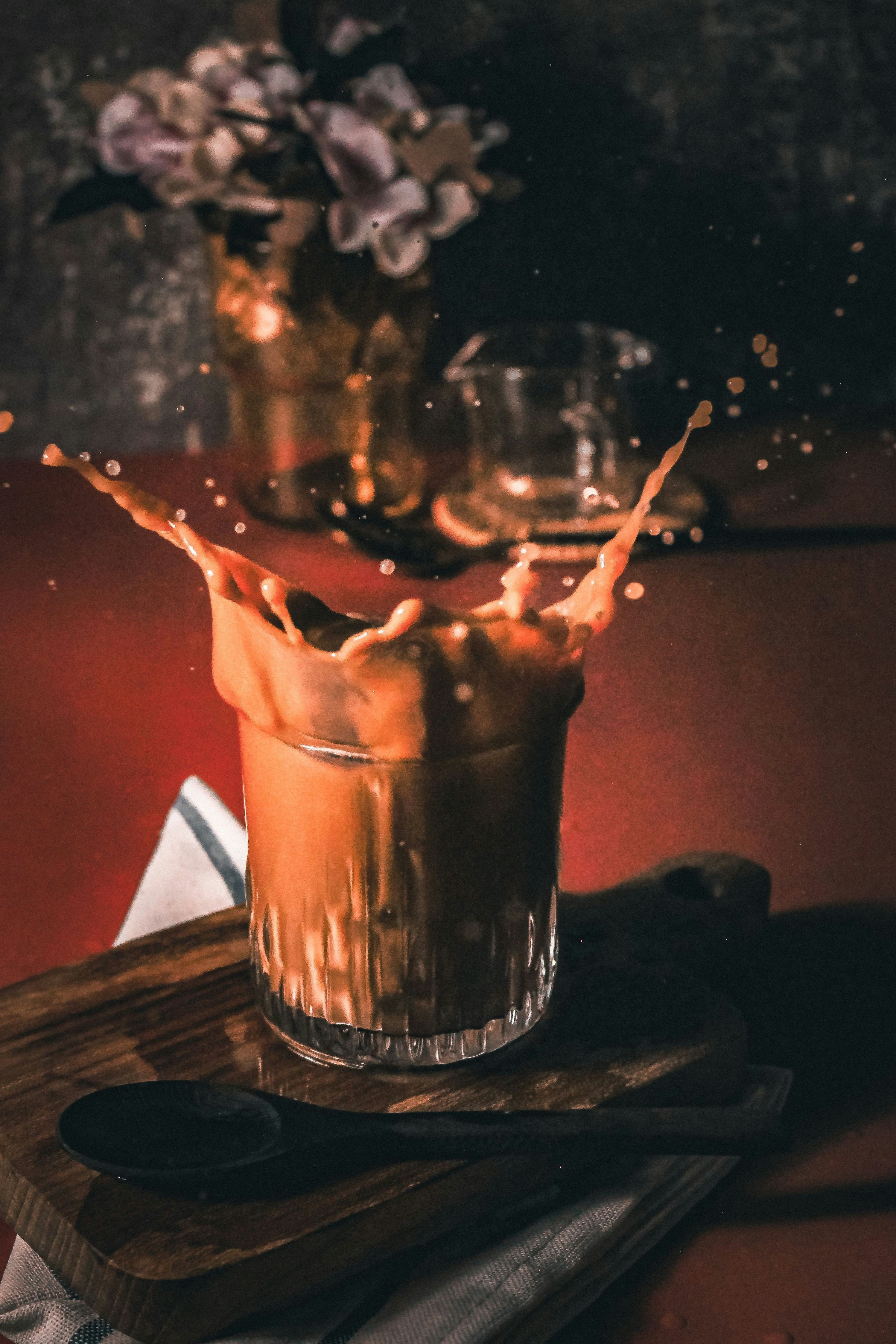 Bartender pouring a sparkling cocktail using Grano Maté as a mixer in a dimly lit moody bar setting Bartender pouring a sparkling cocktail using Grano Maté as a mixer in a dimly lit moody bar setting