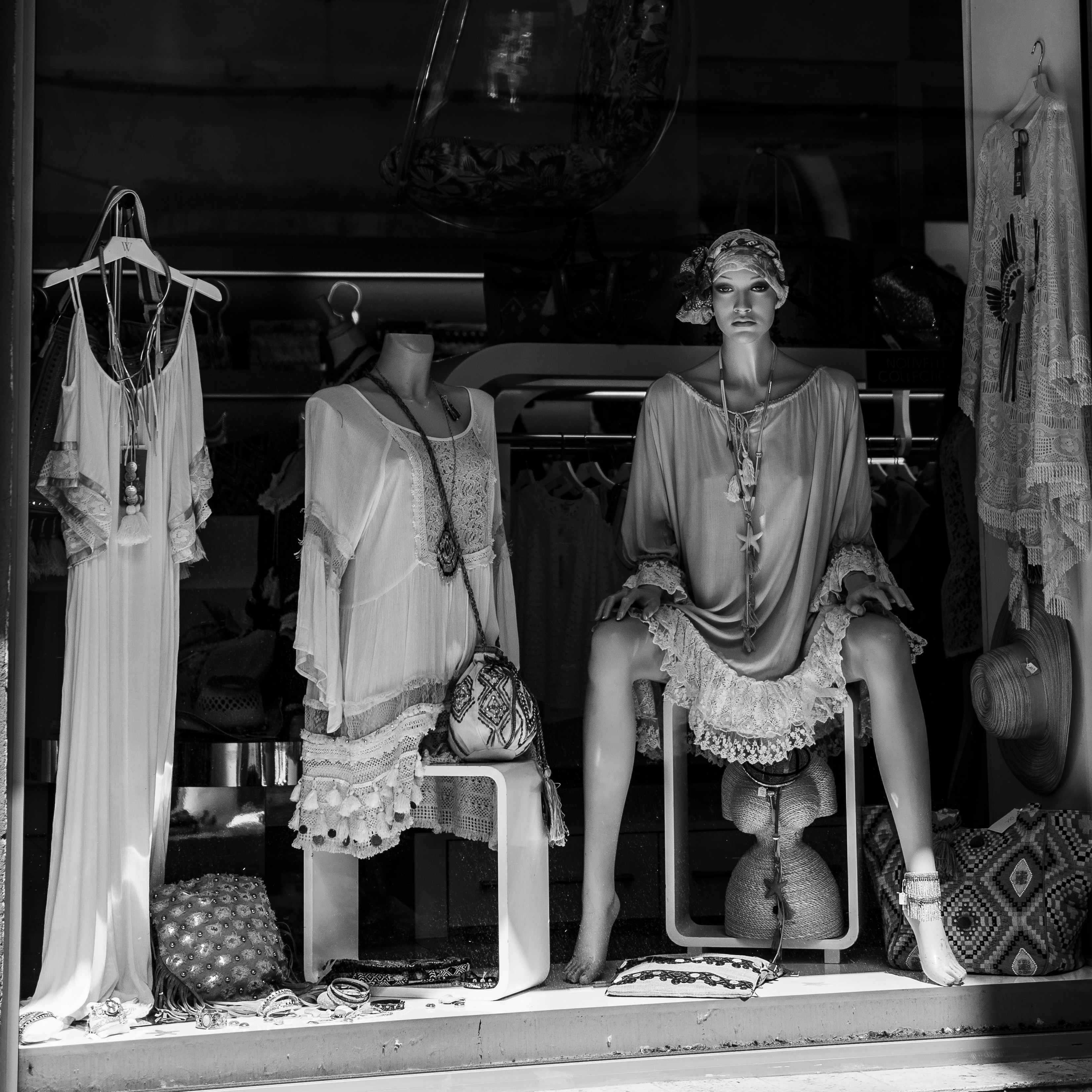 Unsplash image of a woman looking at clothes in a modern boutique