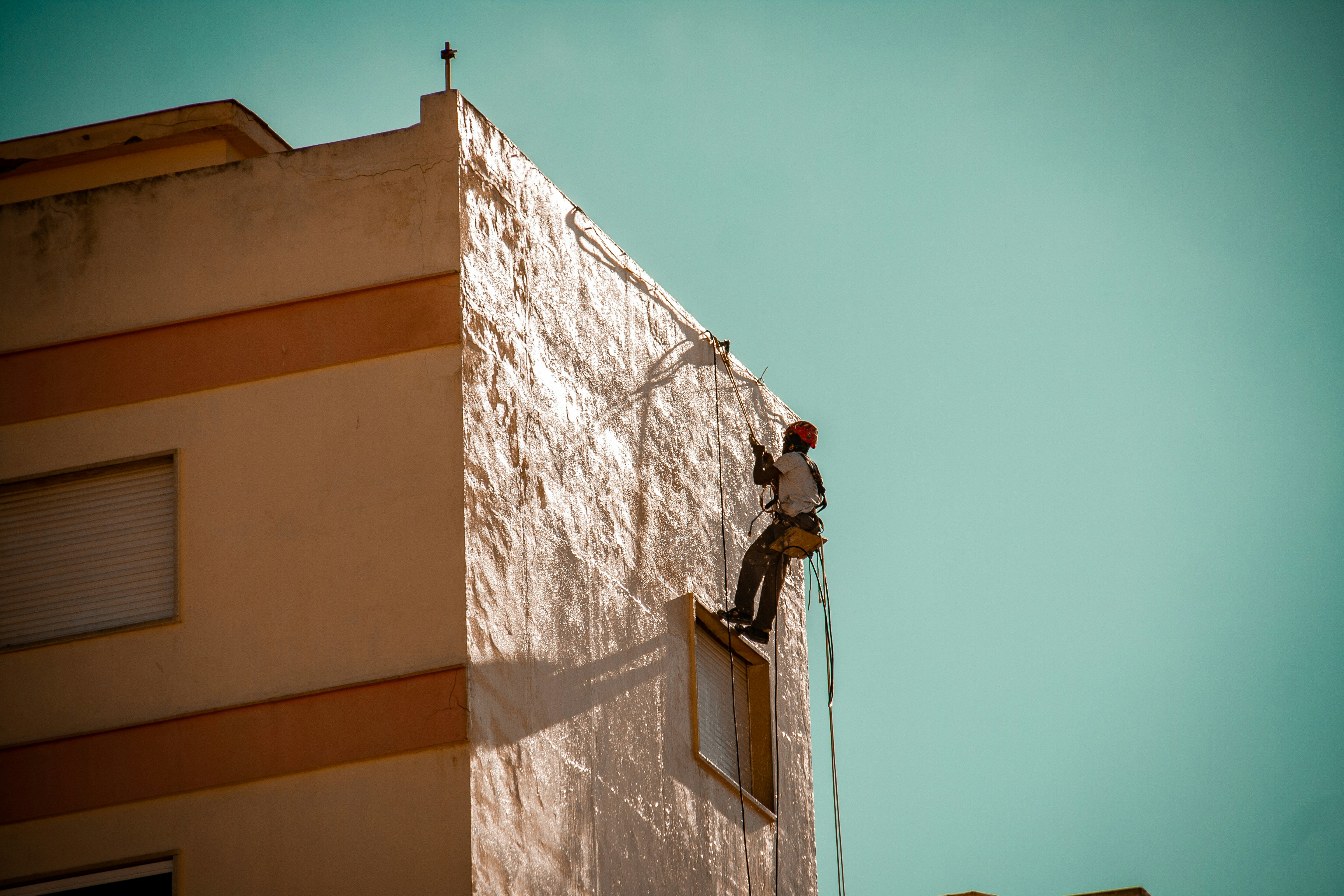Close up of a construction manager hands holding a tablet showing a timeline in a modern swiss apartment renovation site
