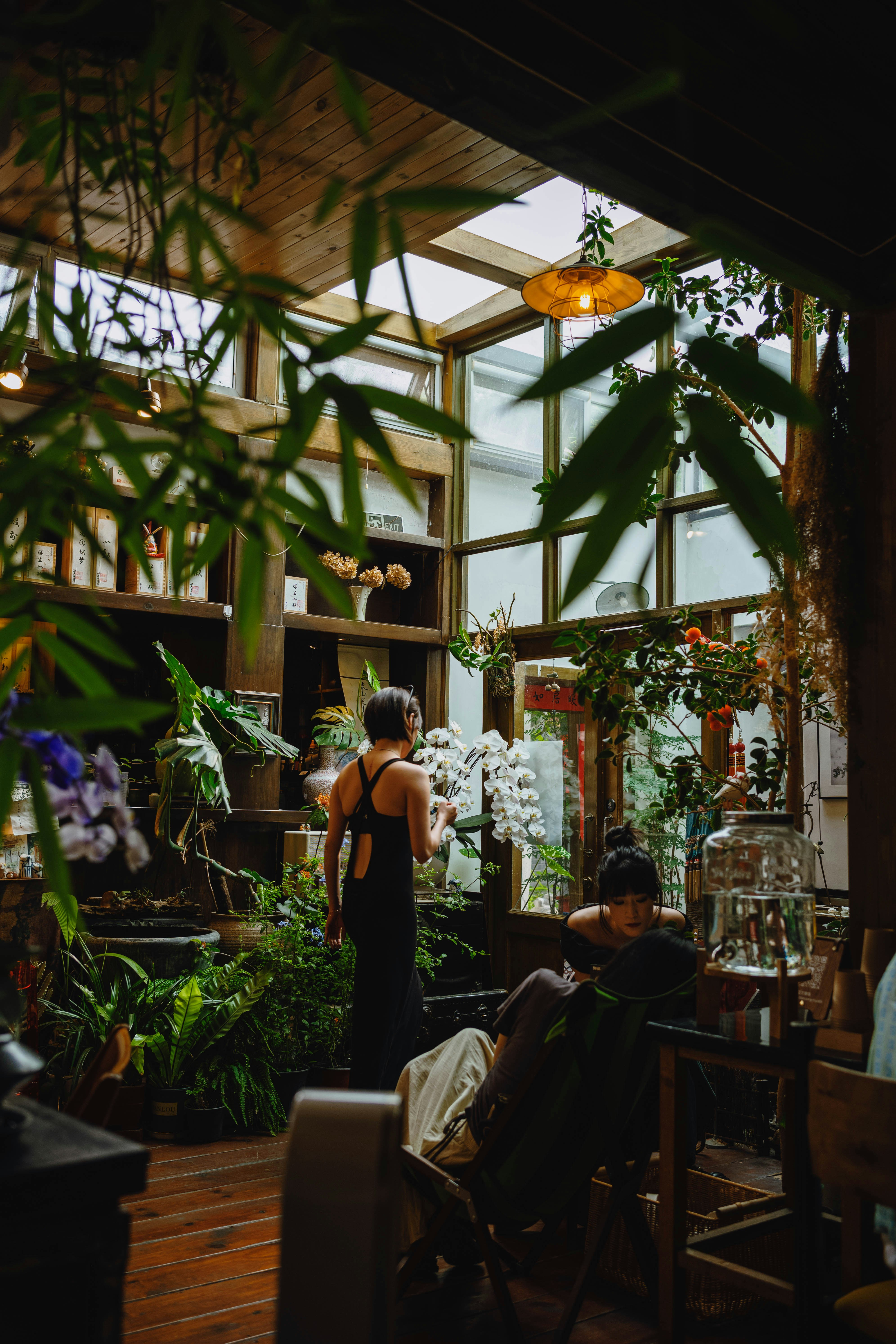 Busy eclectic interior of a california bohemian boutique with plants and rugs