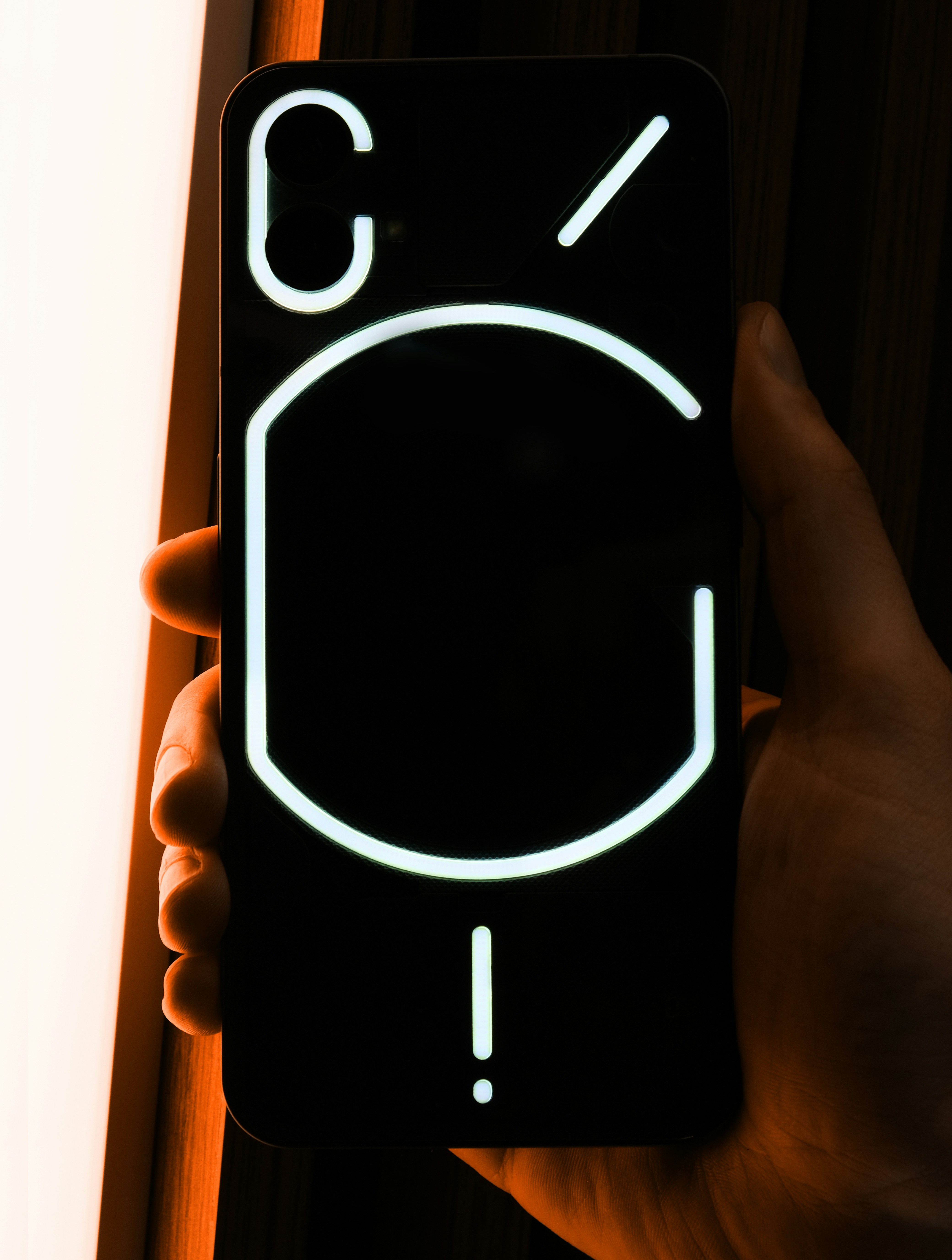 Close up of a smartphone scanning a QR code on a table tent in a comedy club environment.