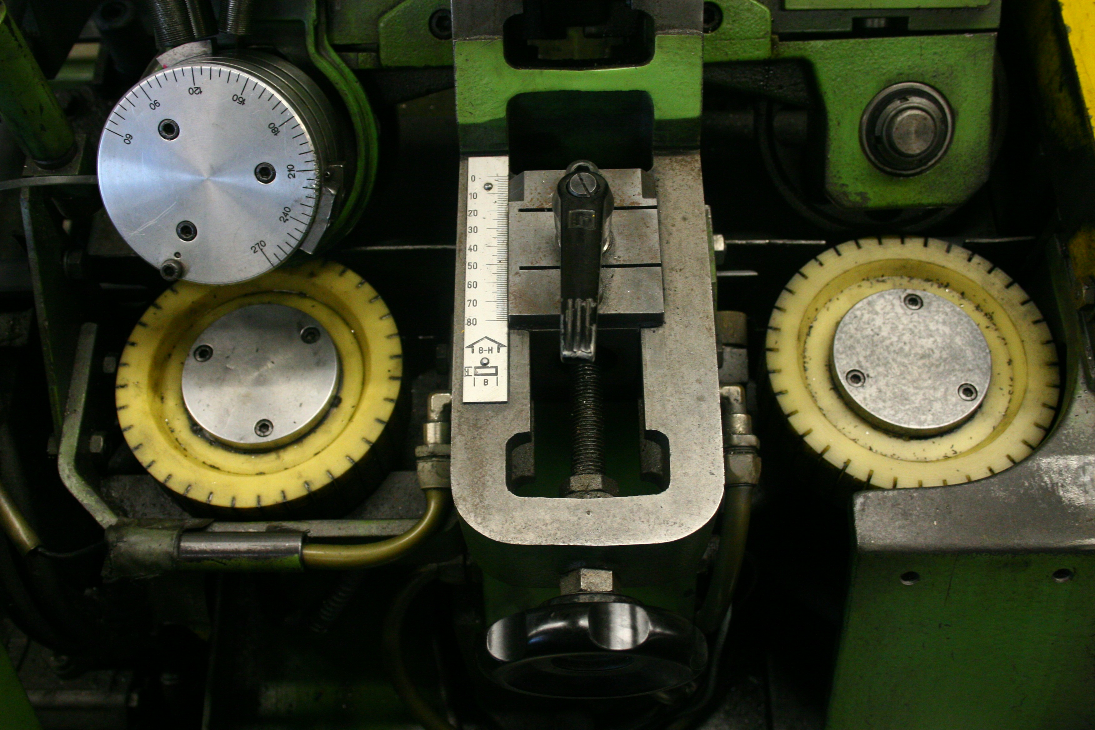 Close up of heavy duty agricultural machine parts gears and hydraulics