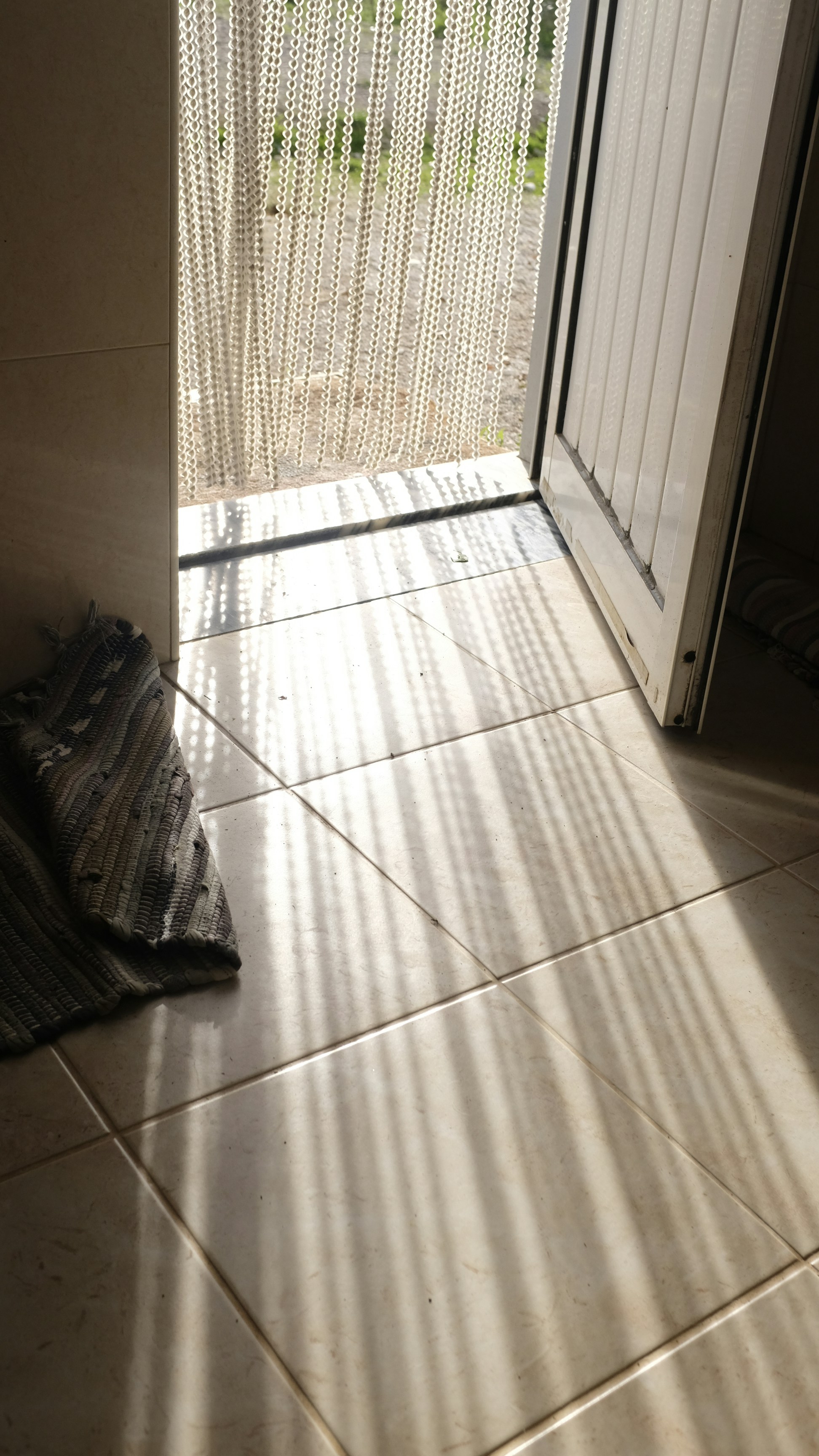 Close-up of dust being cleaned from horizontal blind slats
