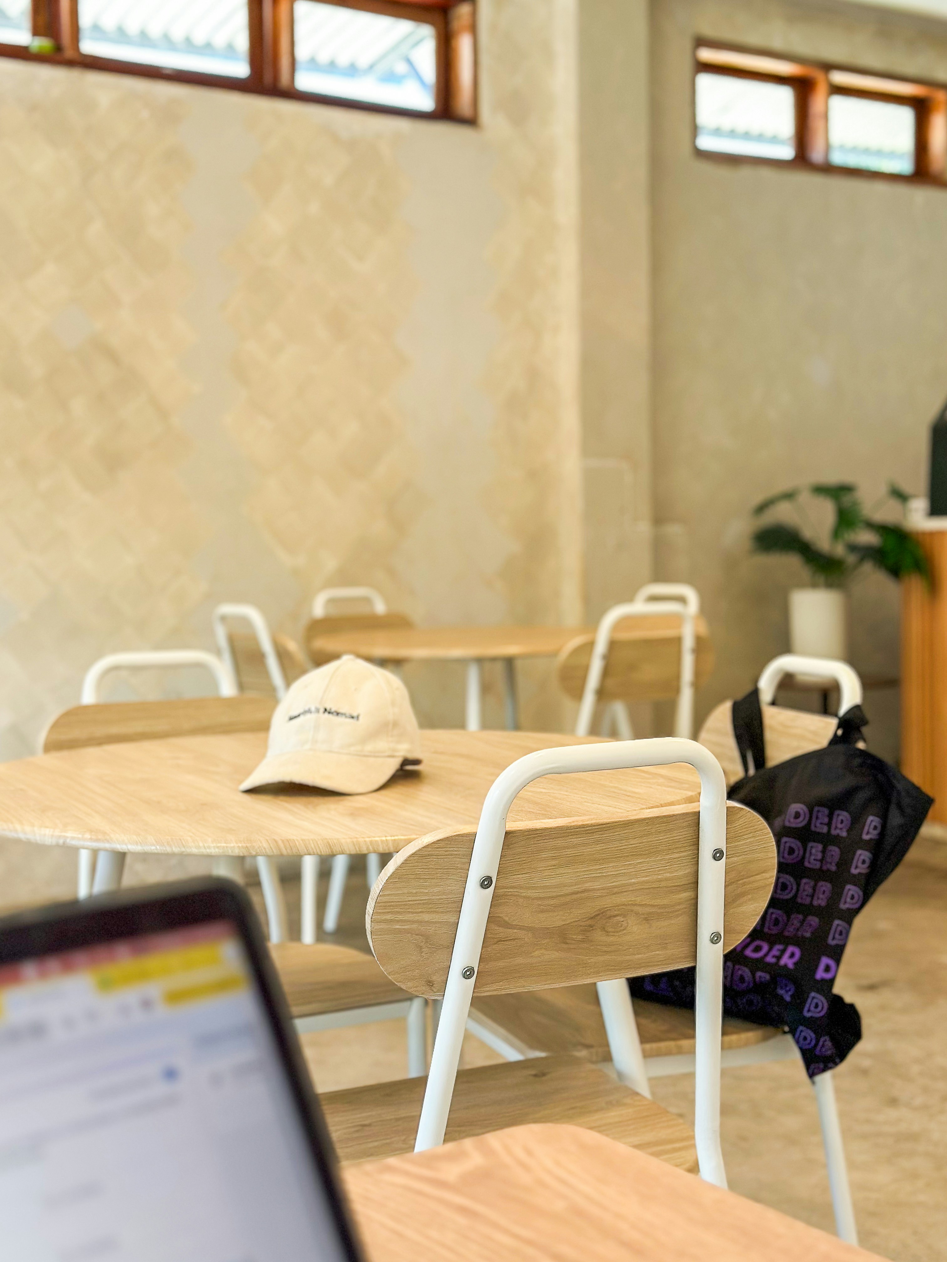 Happy customer using a smartphone with a high speed loading website in a cafe