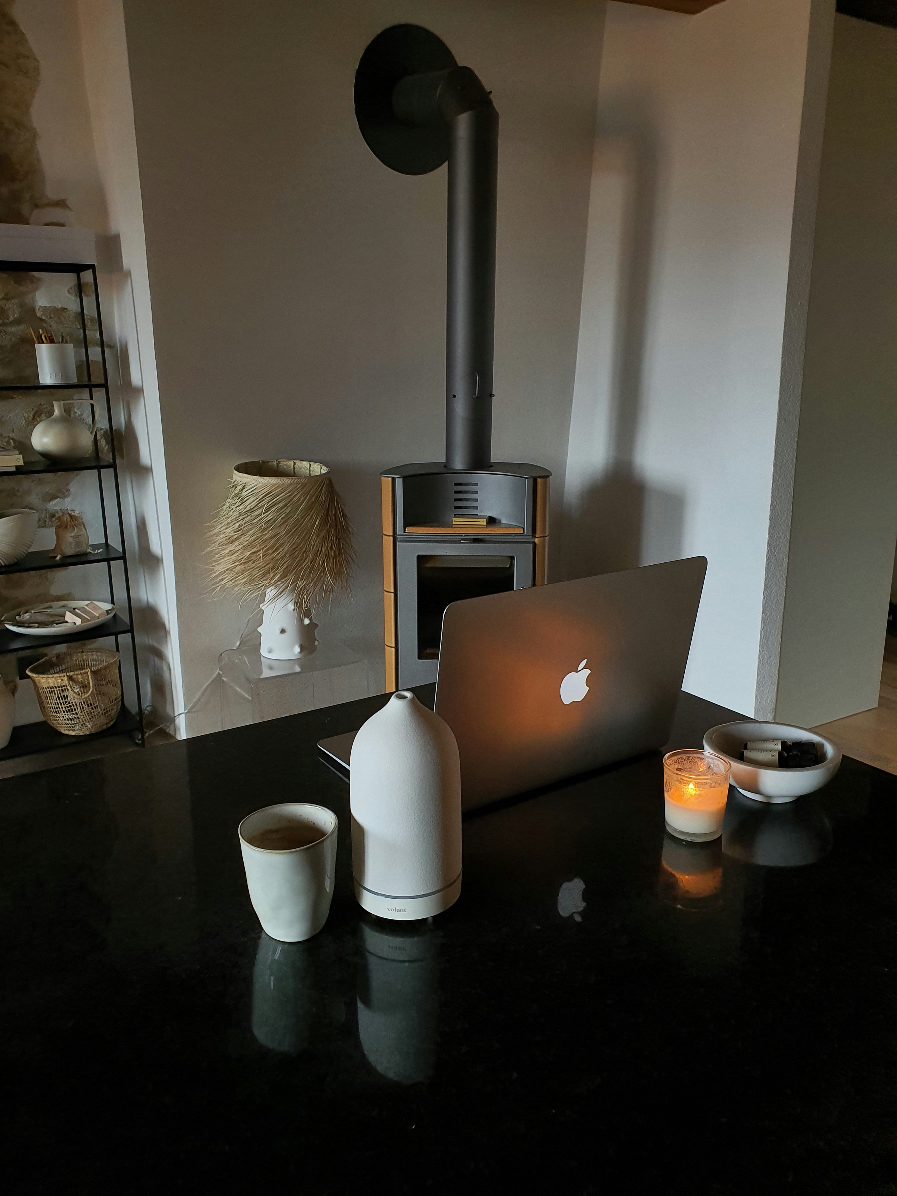 Modern minimalist website layout displayed on a laptop screen next to a coffee cup, visually echoing clean interior design principles