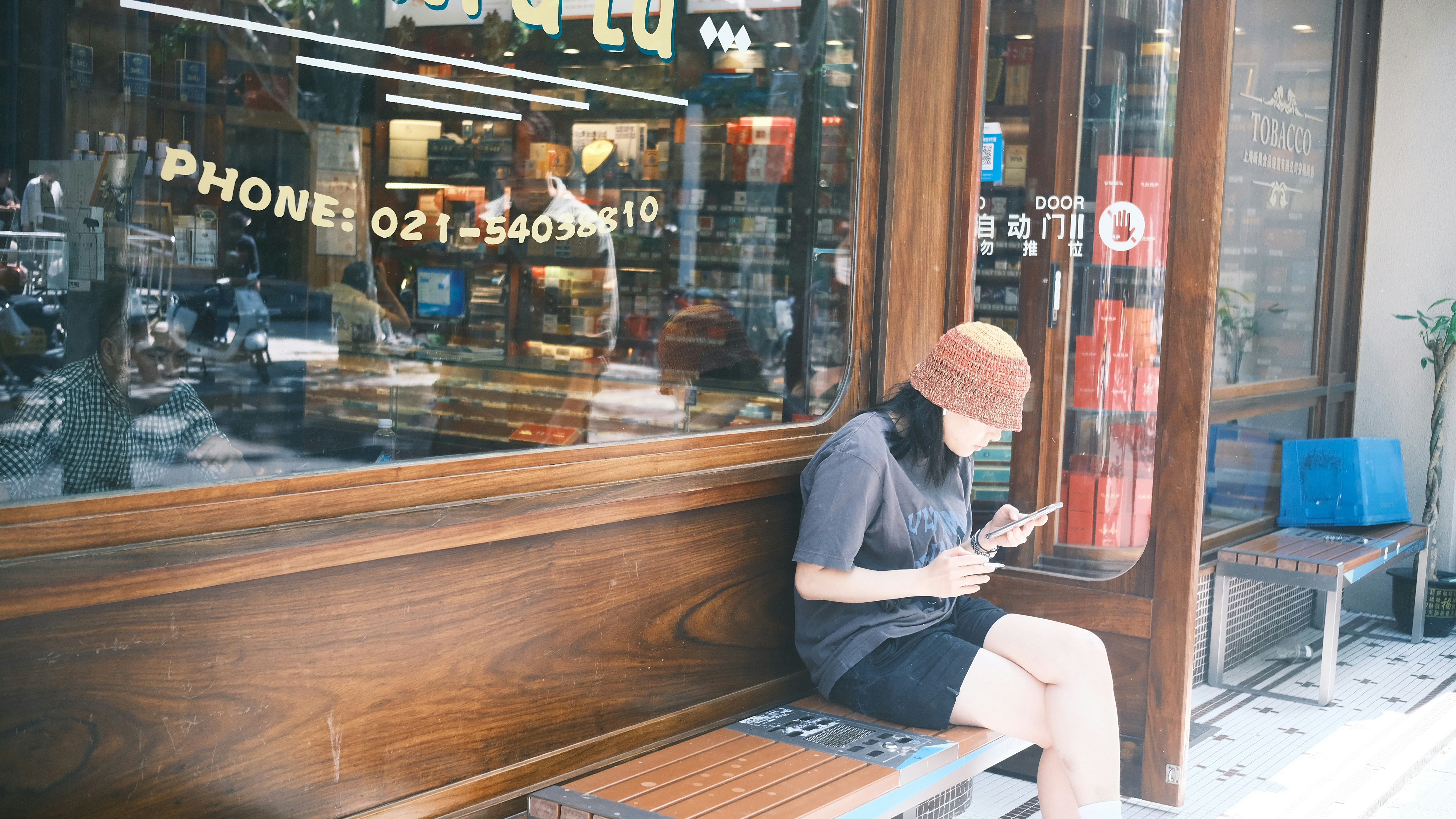Person using smartphone in a coffee shop looking happy with fast loading content
