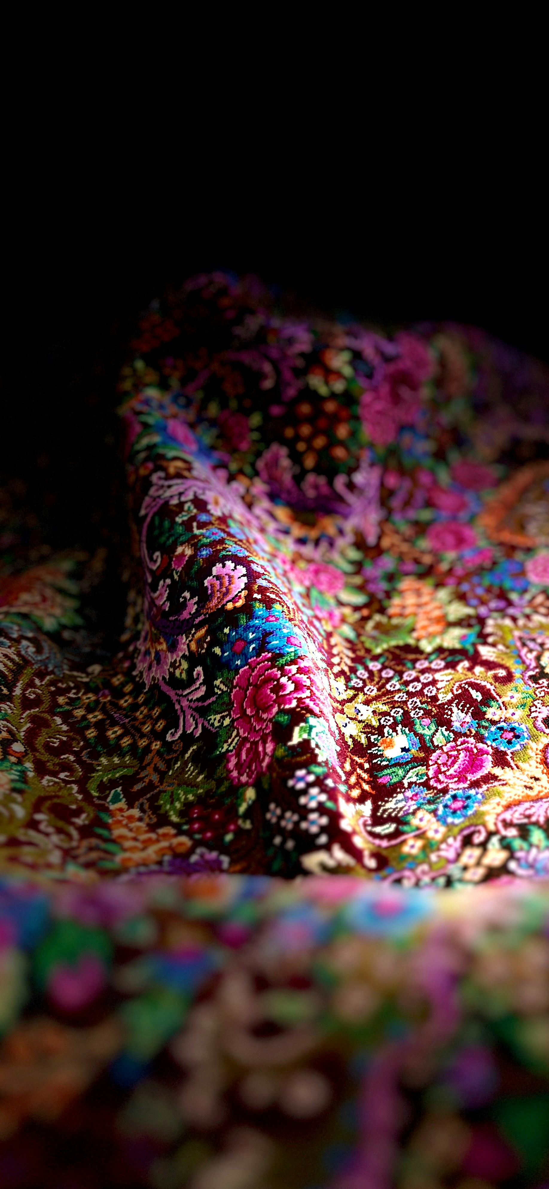 Close up detail of floral fabric and sewing on a vintage dress