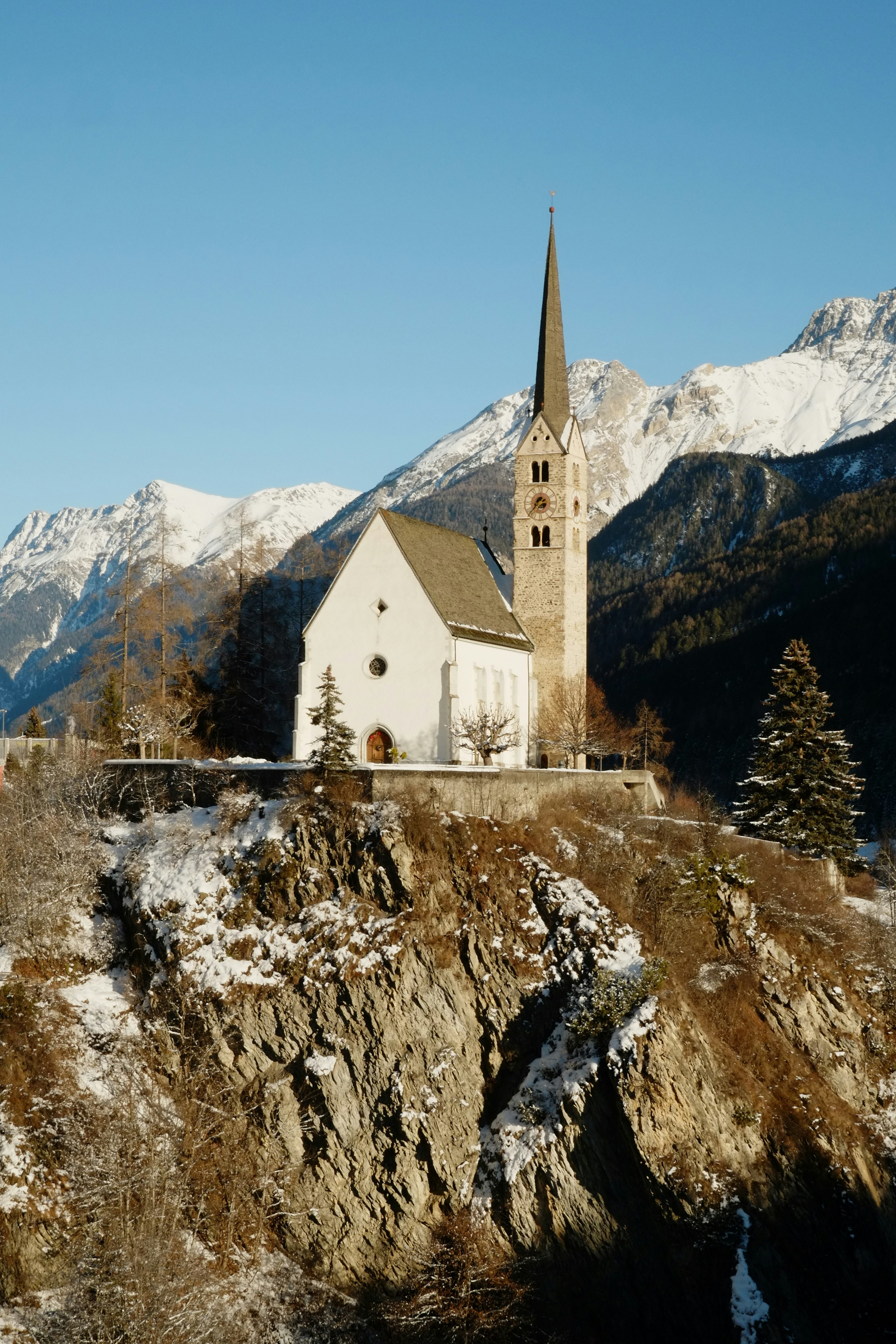 Natural light falling on a bride's face inside a swiss church, cinematic and moody style