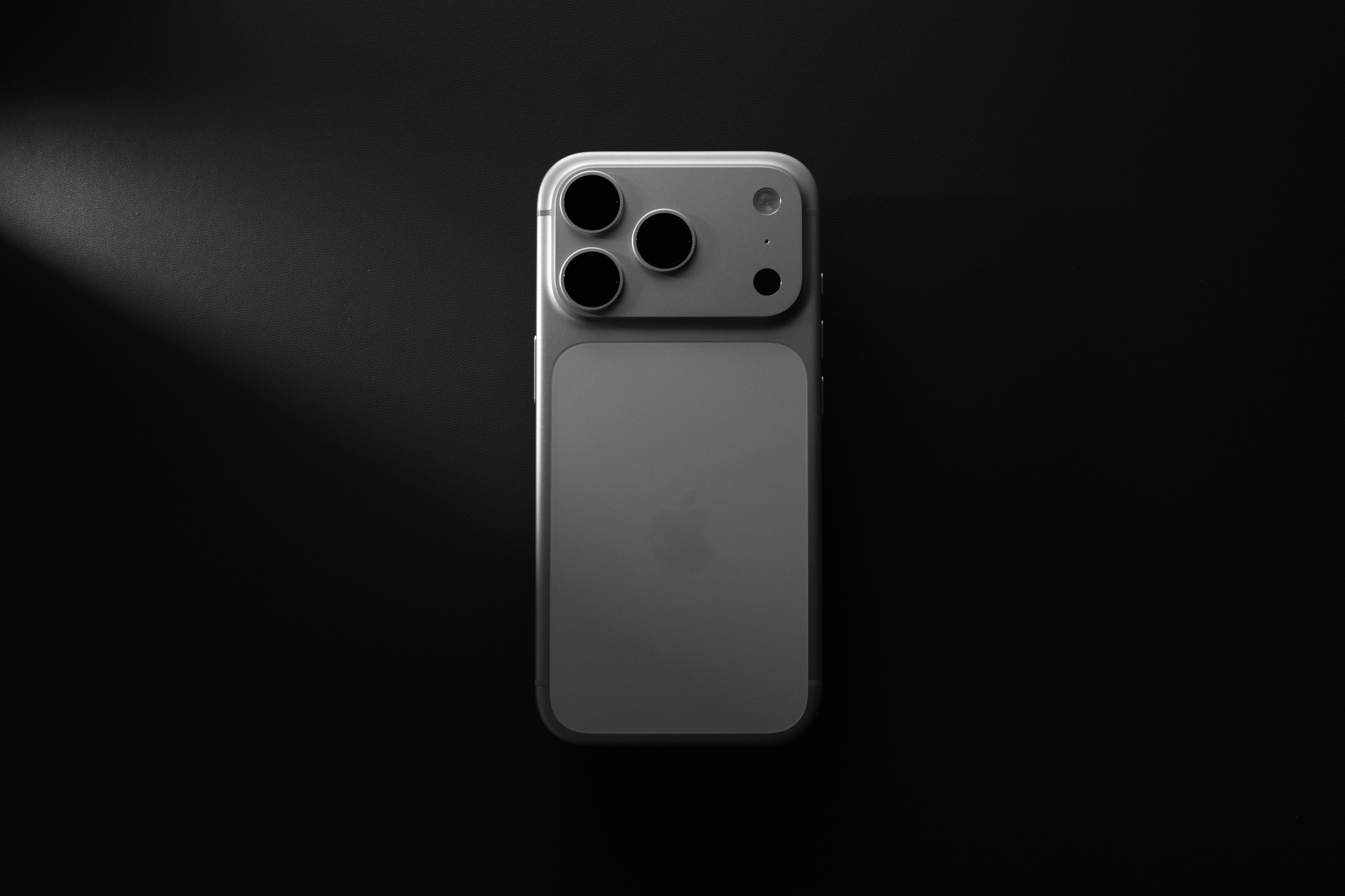 Close up of a smartphone displaying a sleek photography portfolio website