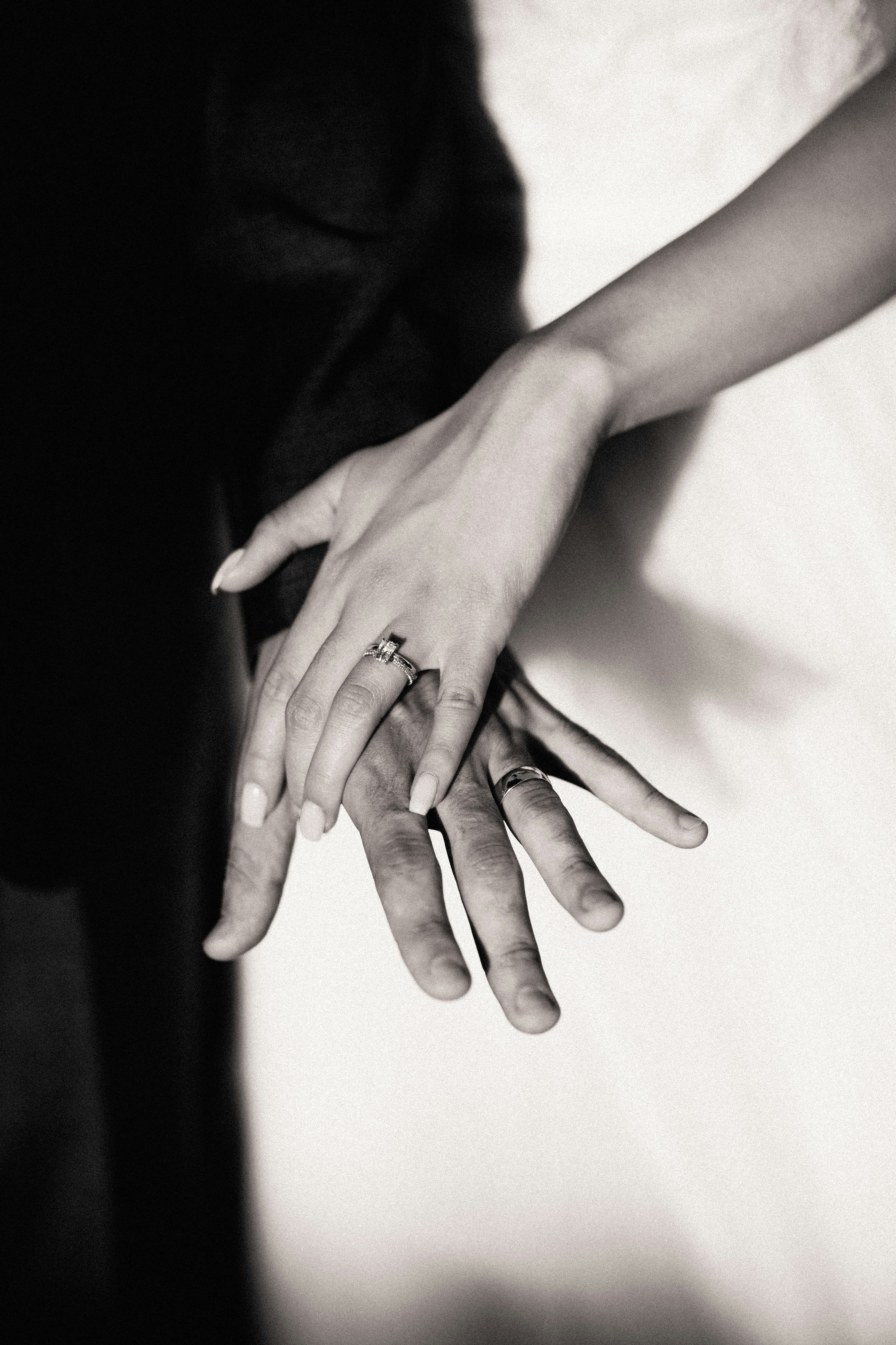 Emotional wedding photography holding hands details black and white
