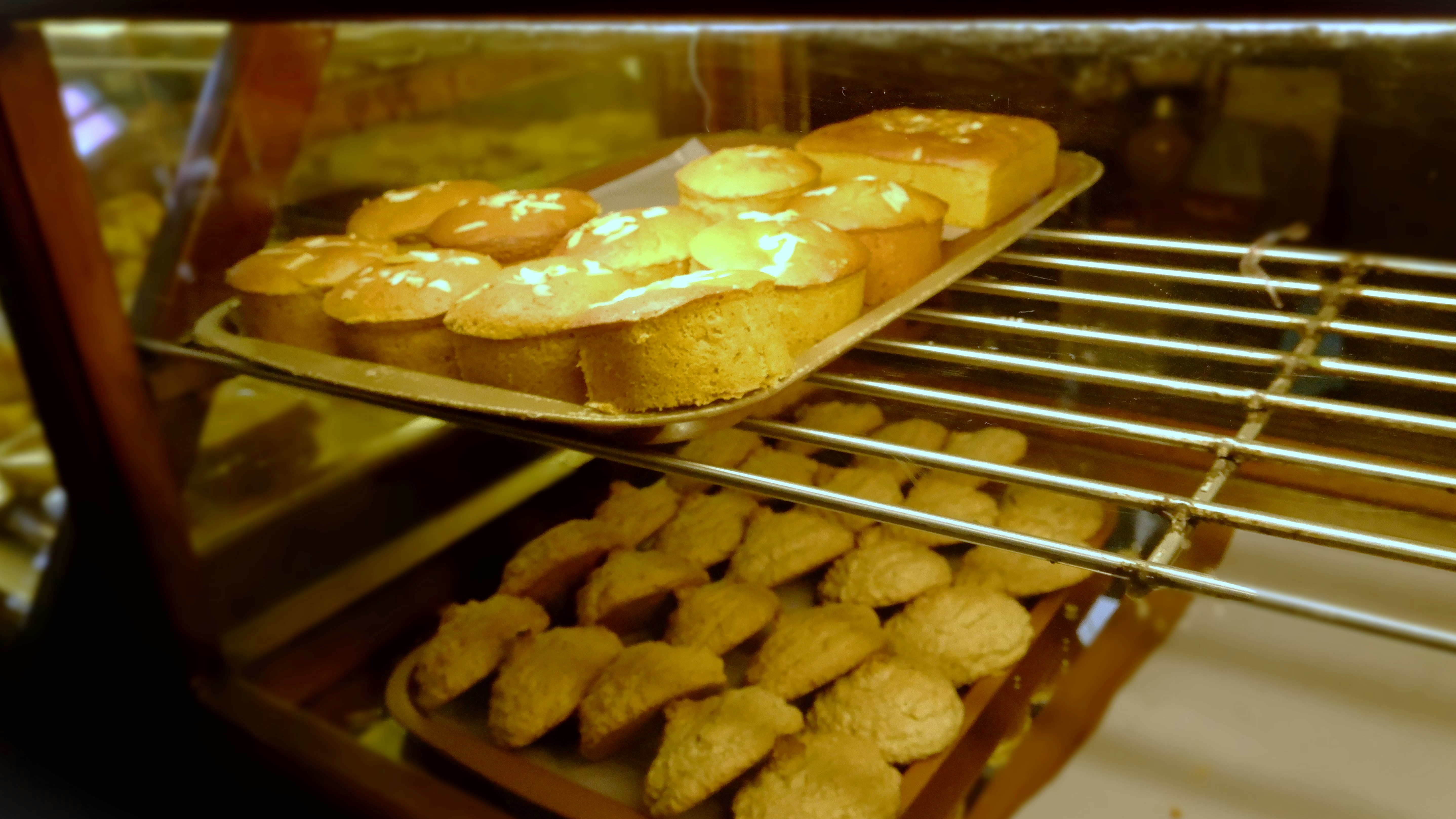 An elegant photo of a variety of swiss pastries arranged on a wooden serving board