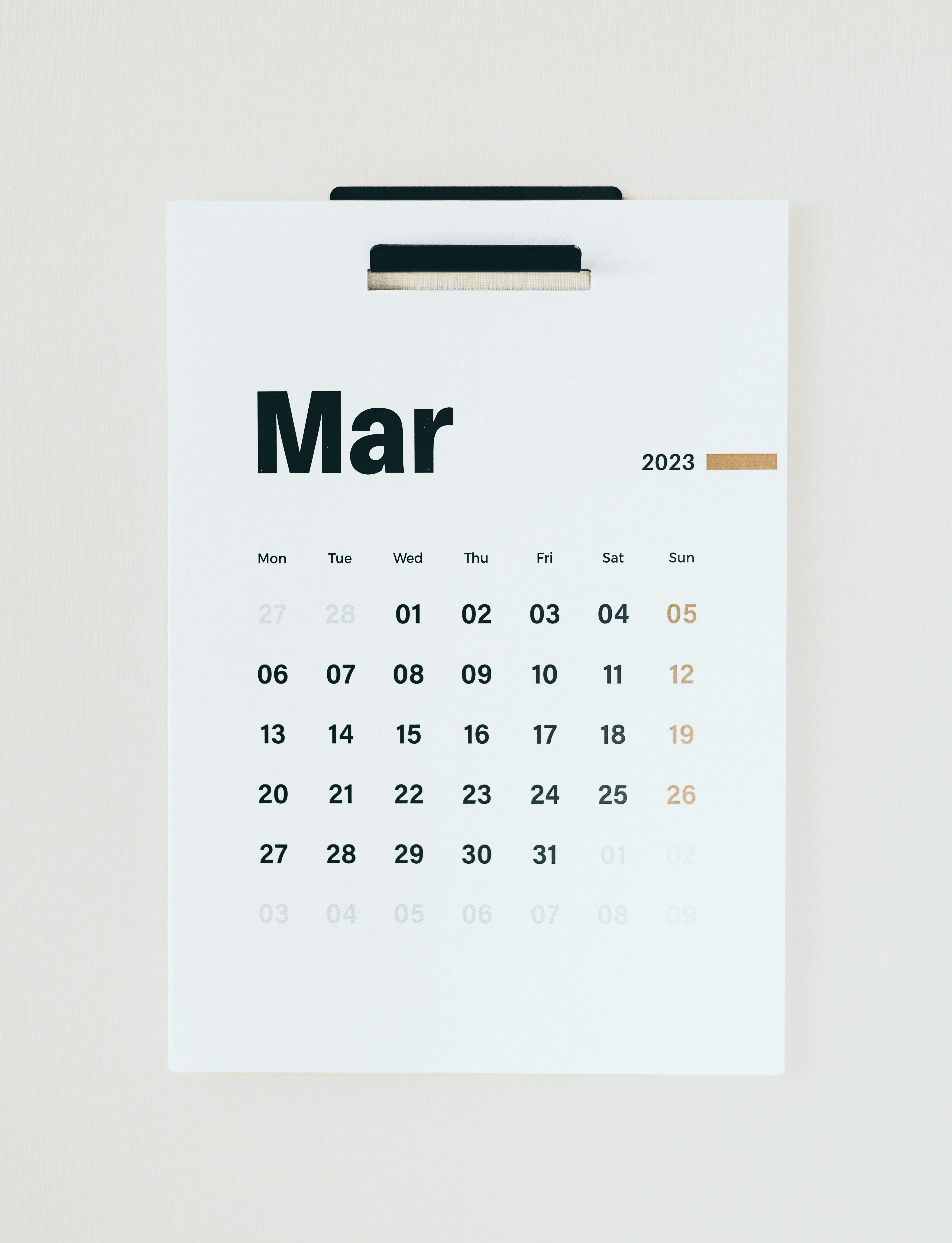 Calendar planning and timeline graphic on a tablet screen held by a business person