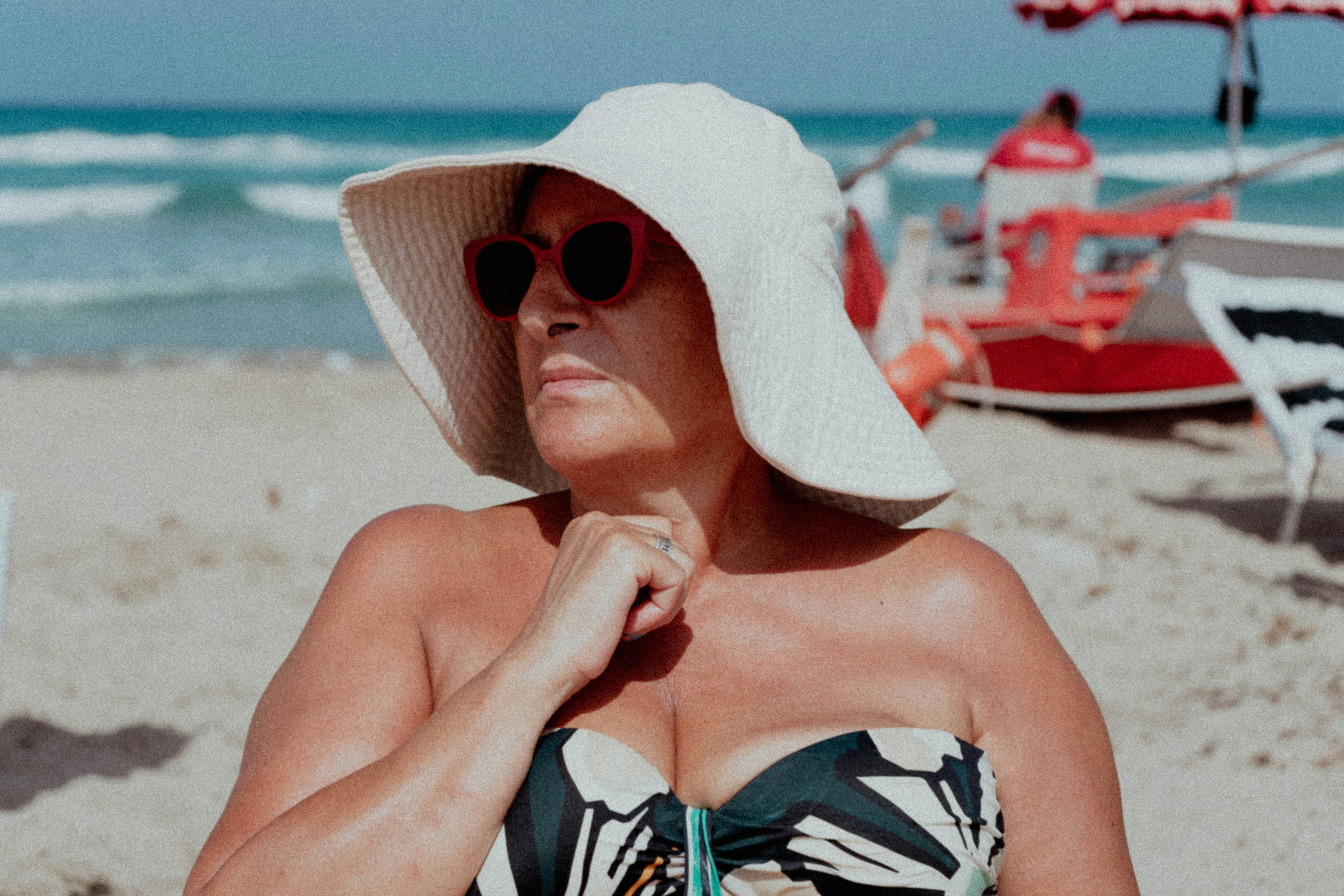 Close-up portrait of a smiling woman looking confident during a corporate photoshoot grey background studio lighting