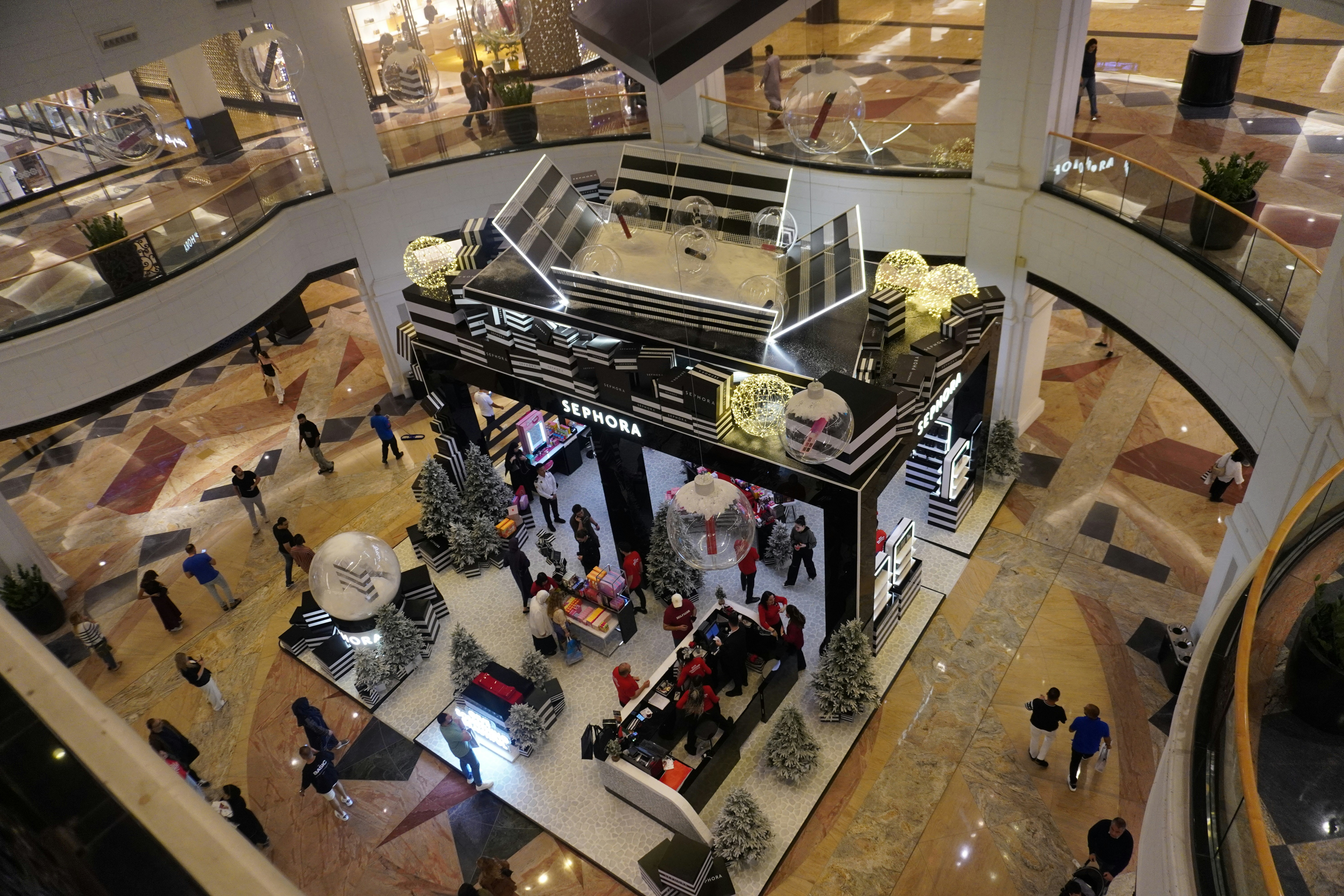 Trendy pop-up store inside a shopping center with customers looking at exclusive products