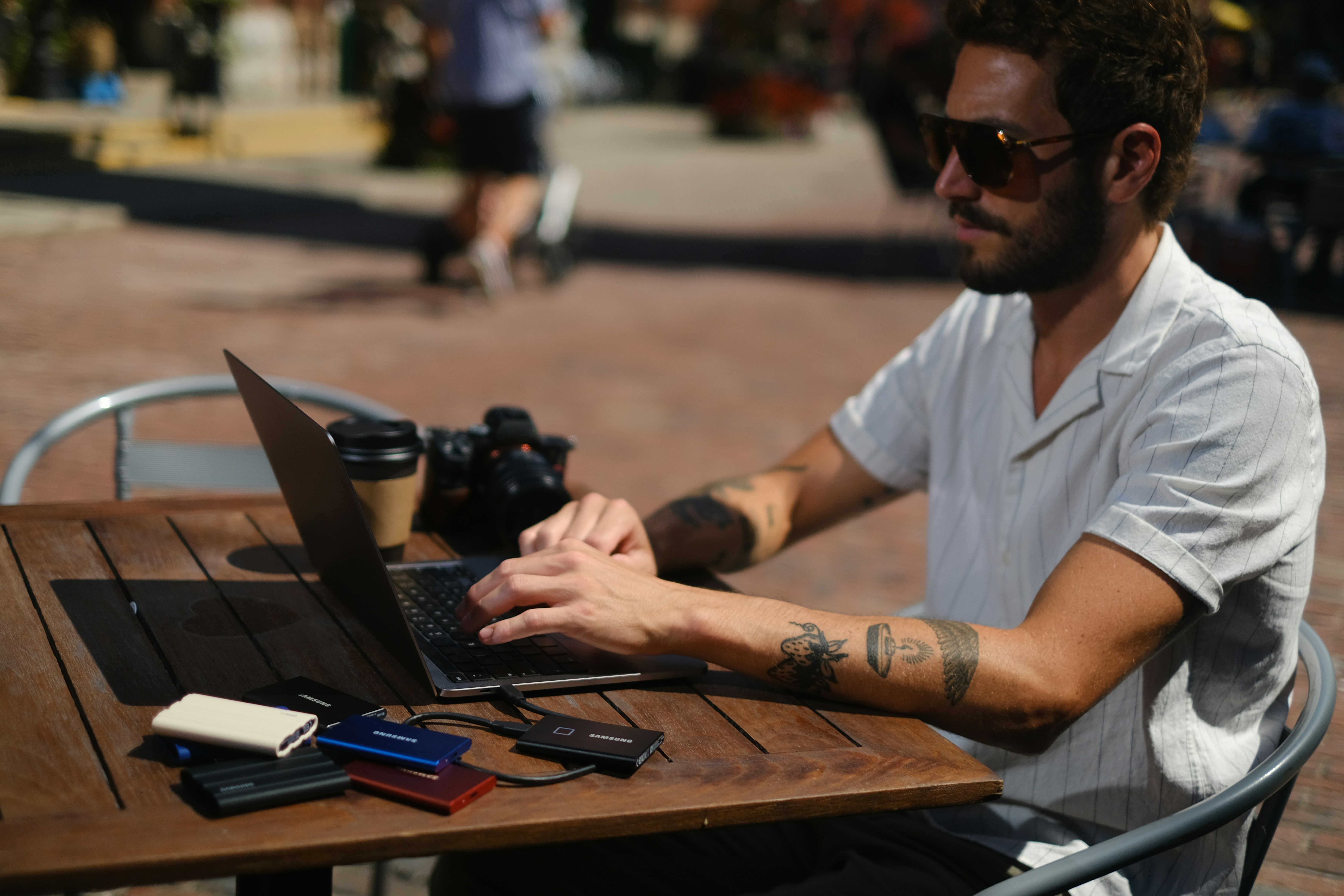 Man working on laptop in a modern coffee shop