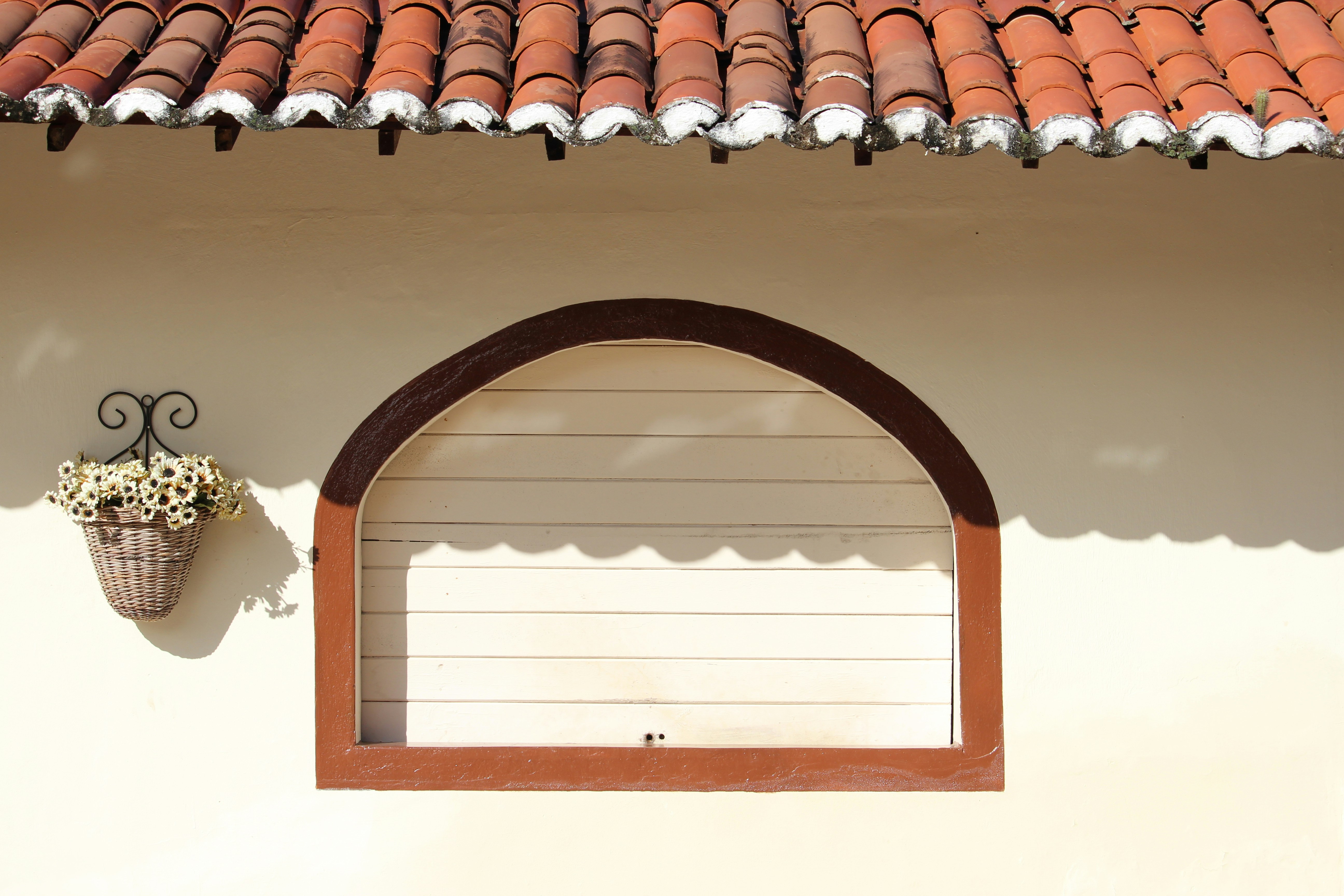 Tools of a glazier on a wooden table: glass cutter, suction cup, silicone gun, showing craftsmanship