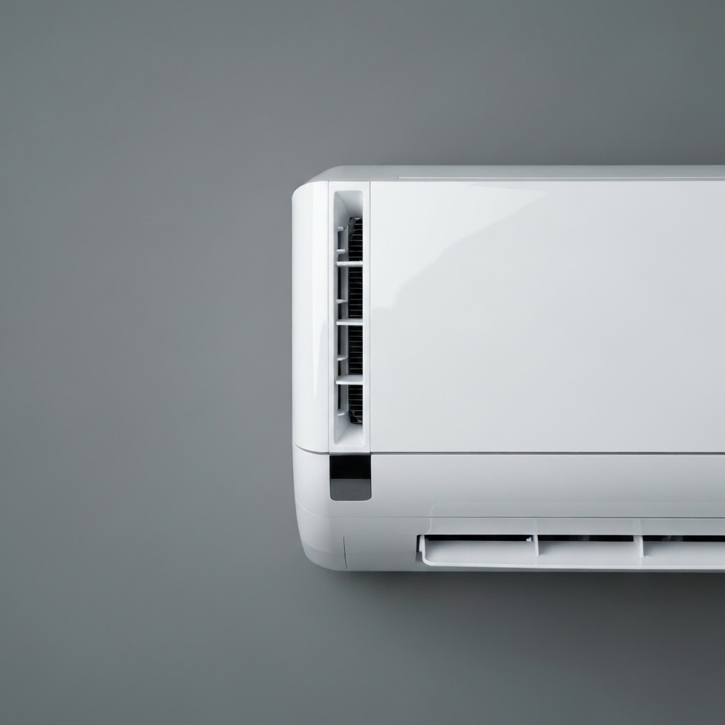 Close up of a modern sleek air conditioner remote control in a hand Close up of a modern sleek air conditioner remote control in a hand