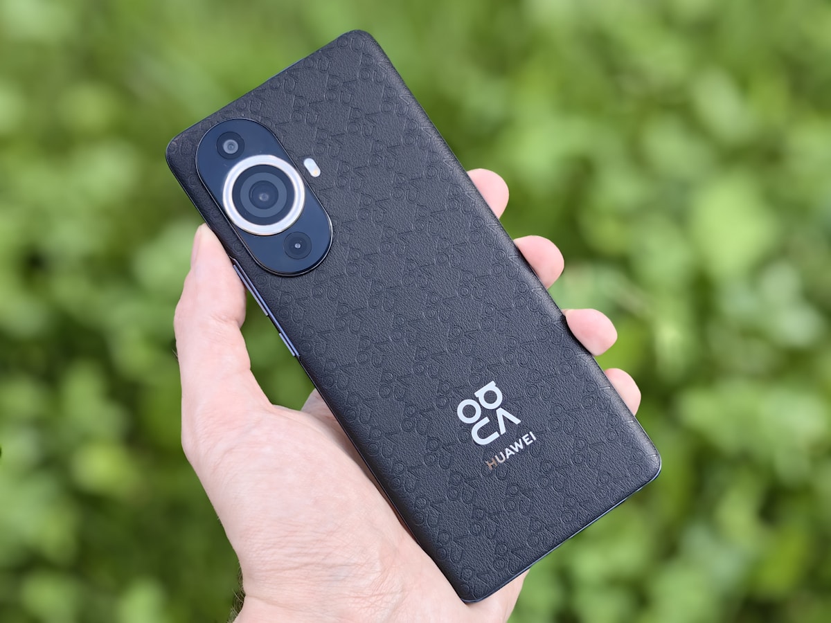 a person holding a cell phone in their hand