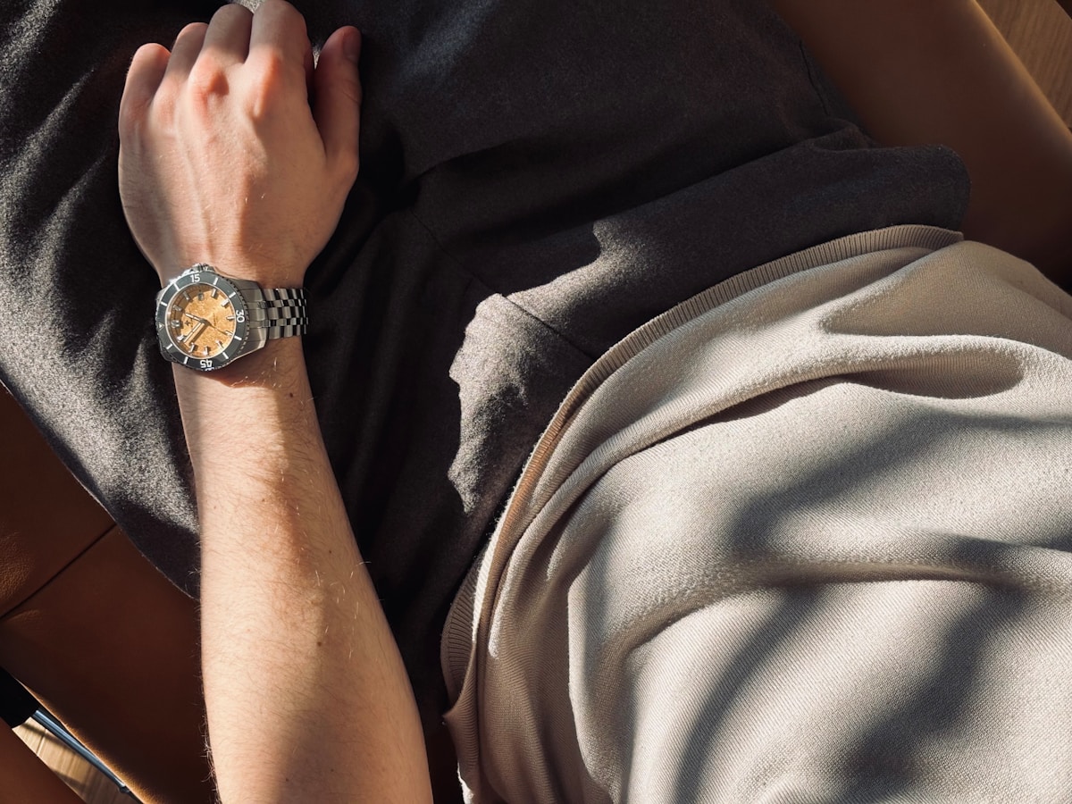 Man wearing a wristwatch on his left arm.