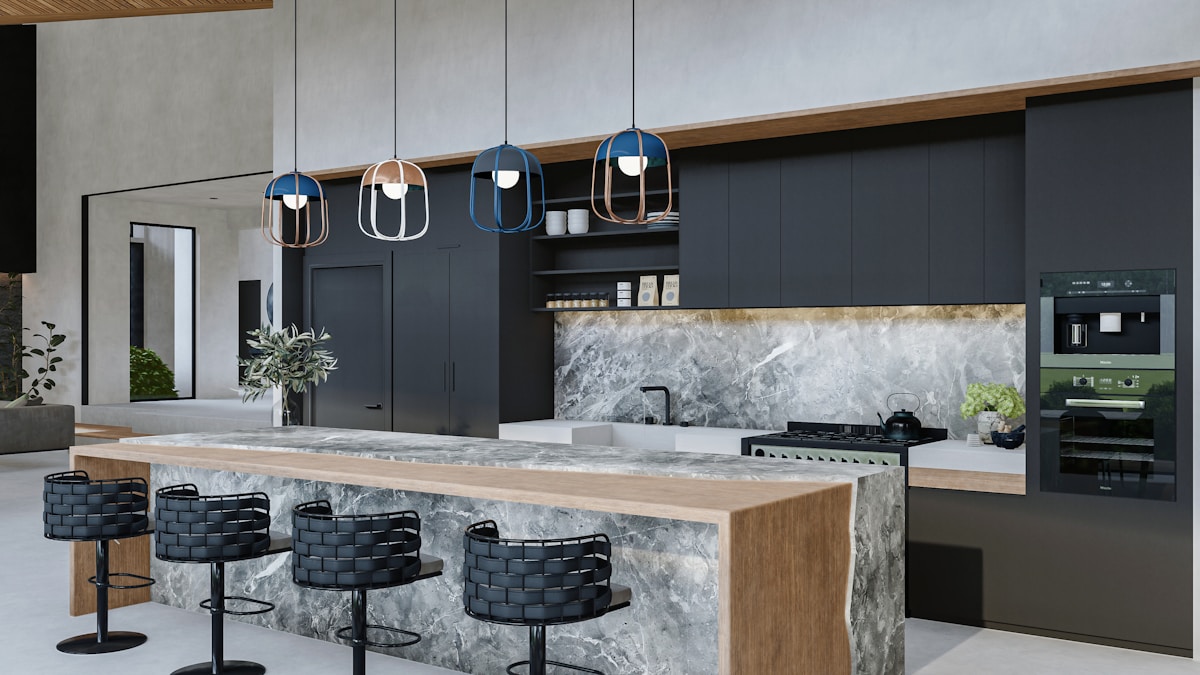 Cuisine moderne avec îlot central en marbre et luminaires suspendus.