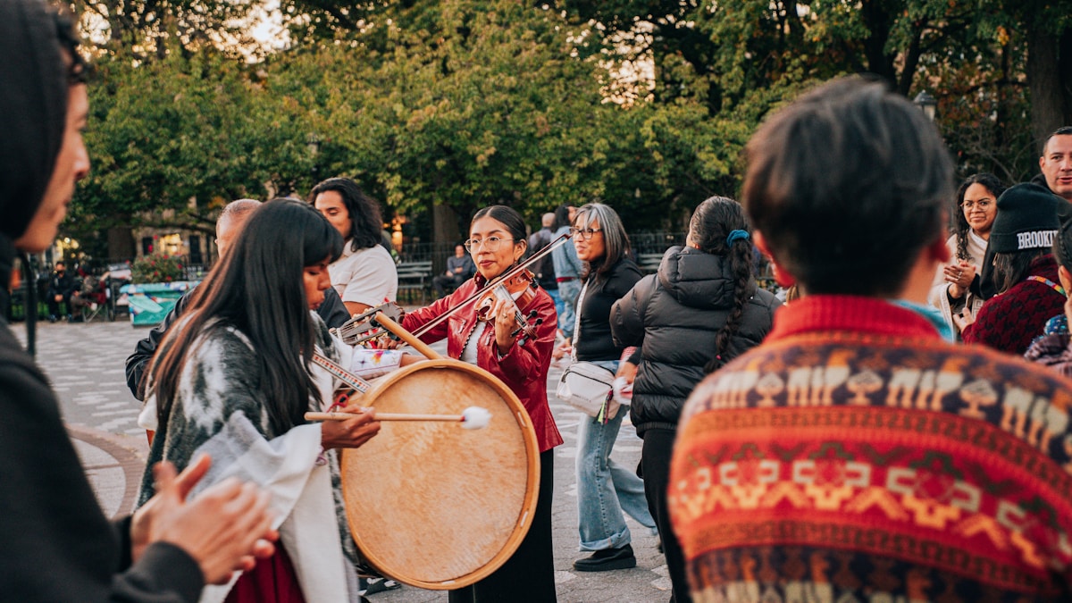 A group of people playing music outdoors