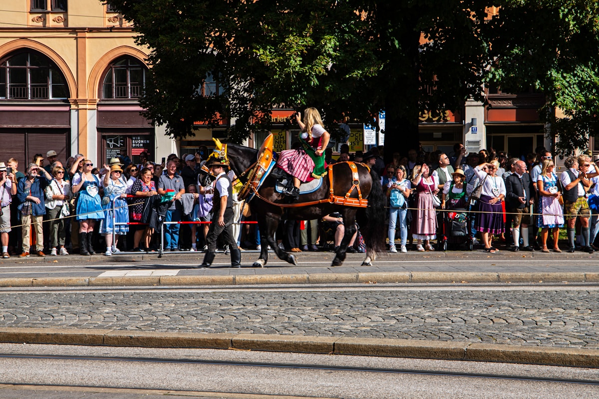 a man riding on the back of a black horse