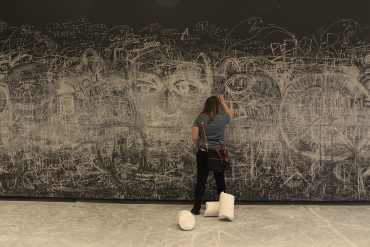 a person standing on a white ball