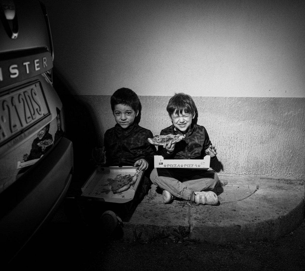 two children sitting on steps