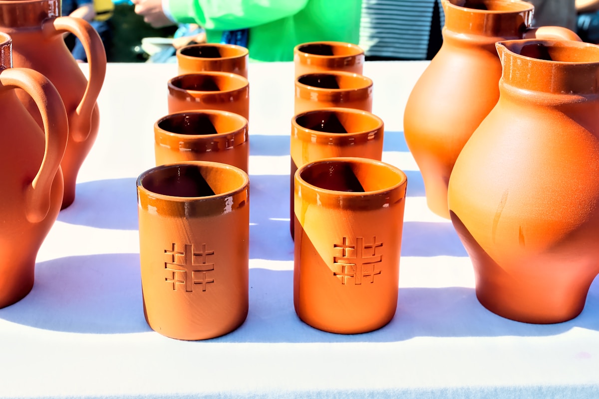 brown clay pots on white surface