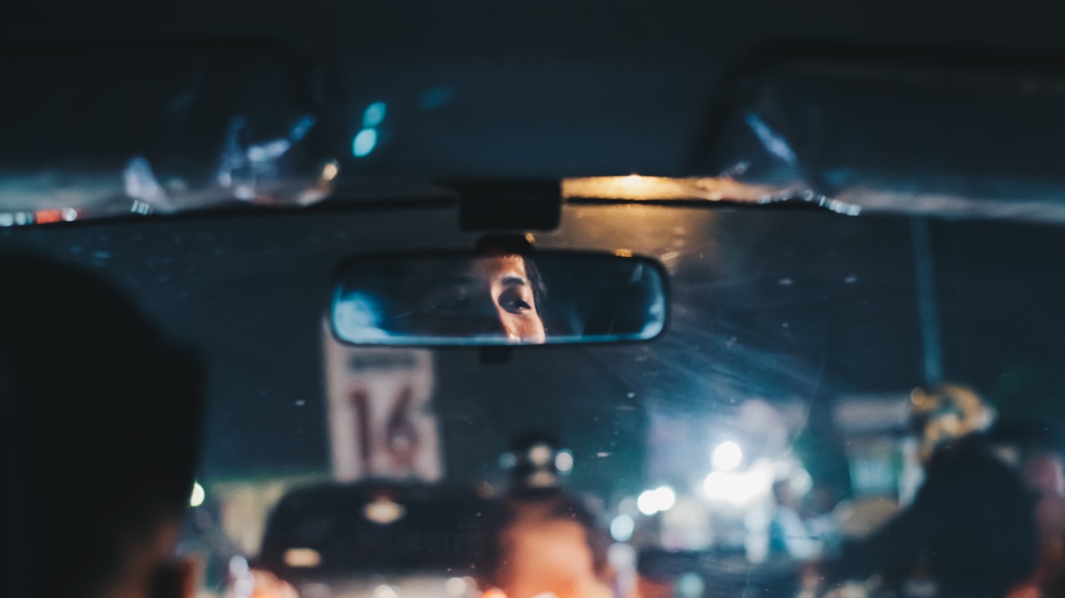 shallow focus photo of car rear mirror