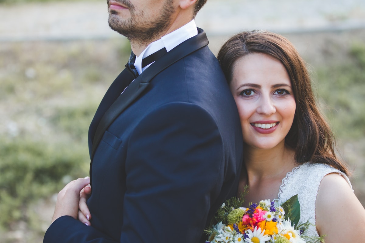a man in a suit and a woman in a wedding dress