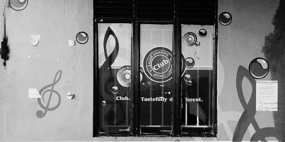 grayscale photo of wooden door