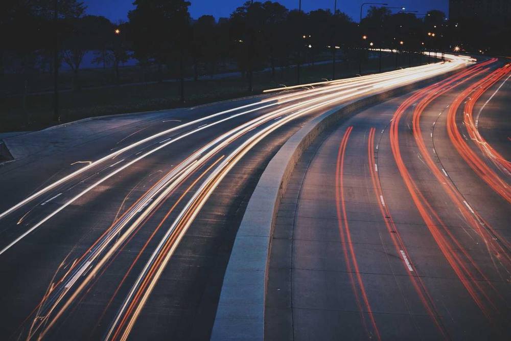 Highway traffic light trails at night.