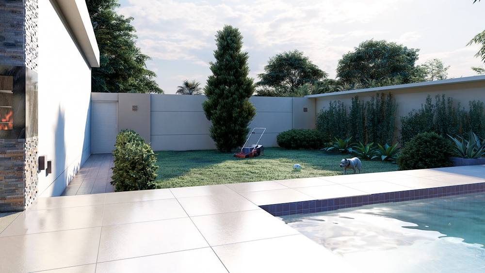 Jardin paysager avec piscine, végétation luxuriante et mobilier extérieur.