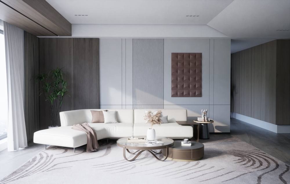 Salon moderne avec canapé blanc, table basse et décoration élégante.